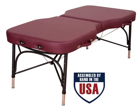Minor chips in leather at one end. . Oakworks massage table